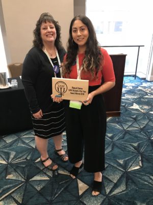 Past-Chair Deb Mollen presenting Raquel Craney with the Student of the Year award